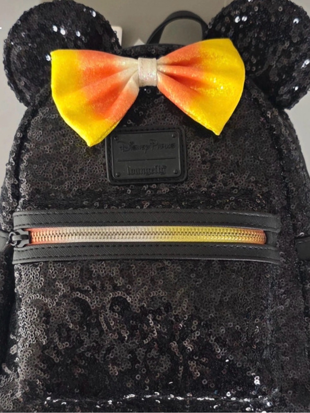 Loungefly Black Sequin Mini Backpack with Yellow-Orange Bow